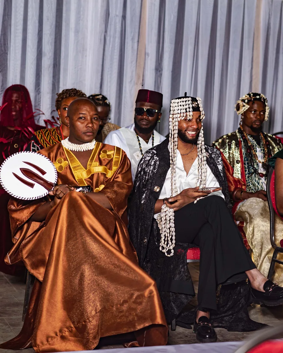Guests in traditional dress in the front row