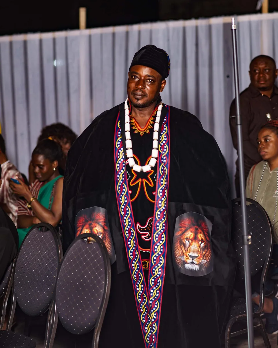 Traditional ruler in a beaded robe at the opening