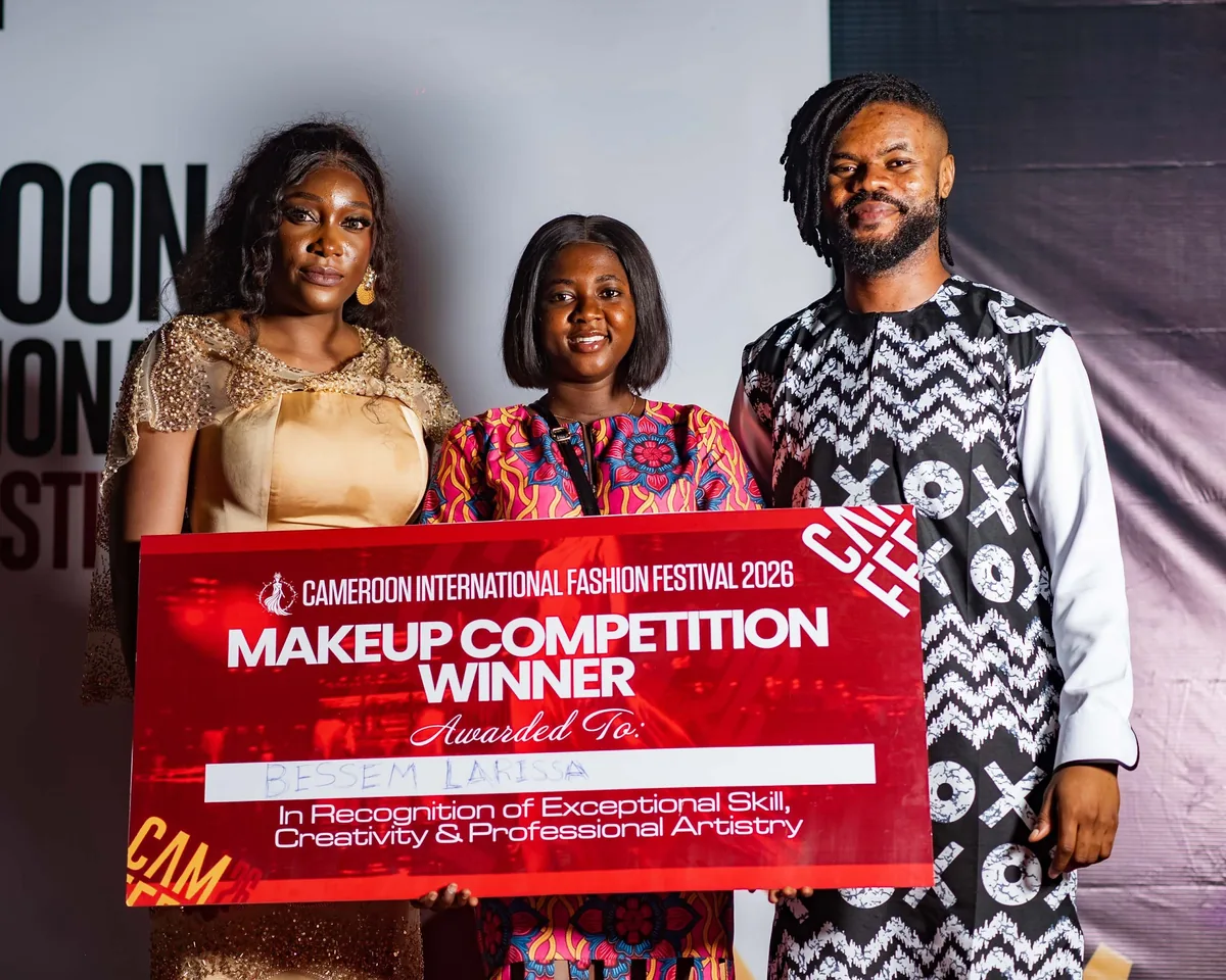 Makeup Competition winner with her award on the red carpet