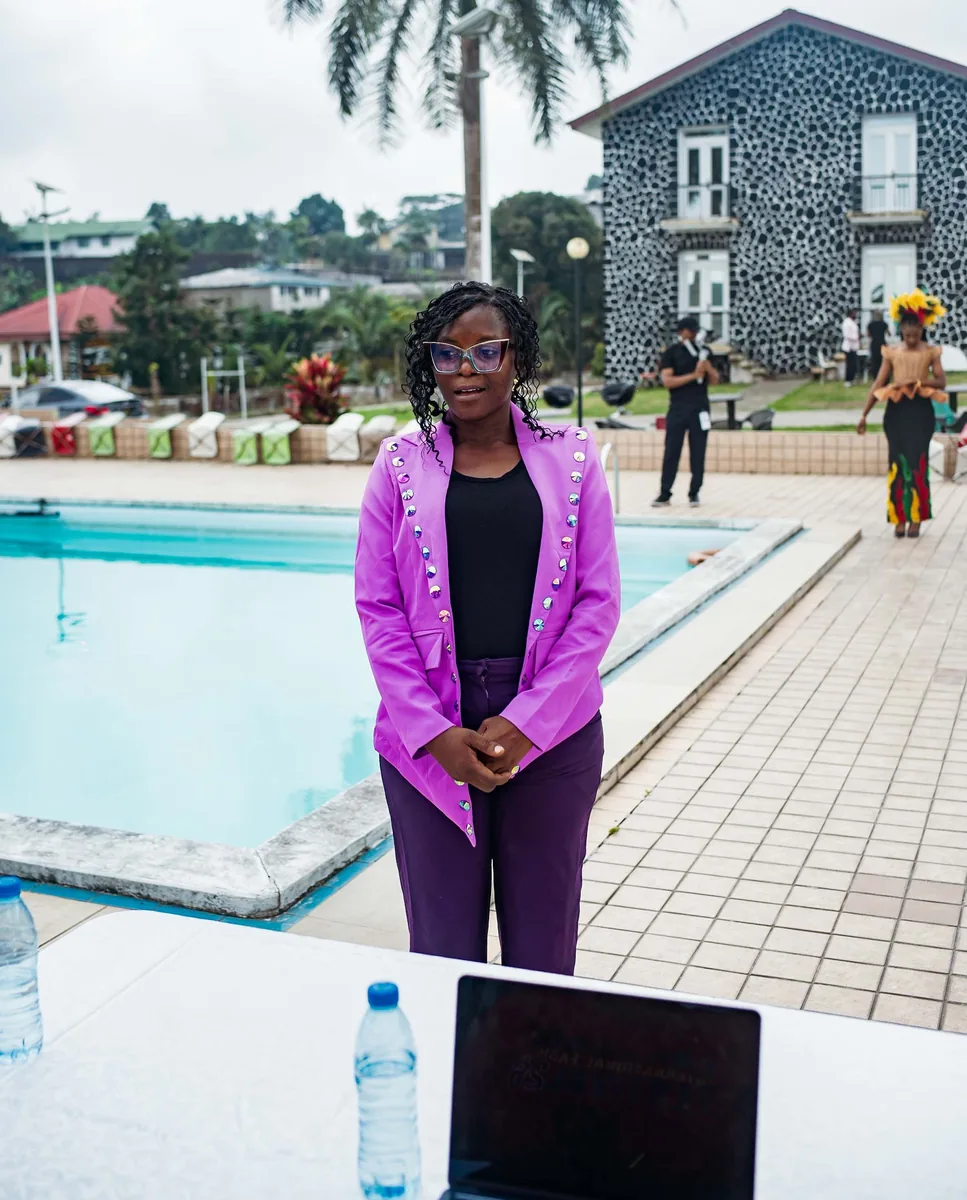 Guest in a violet blazer by the pool