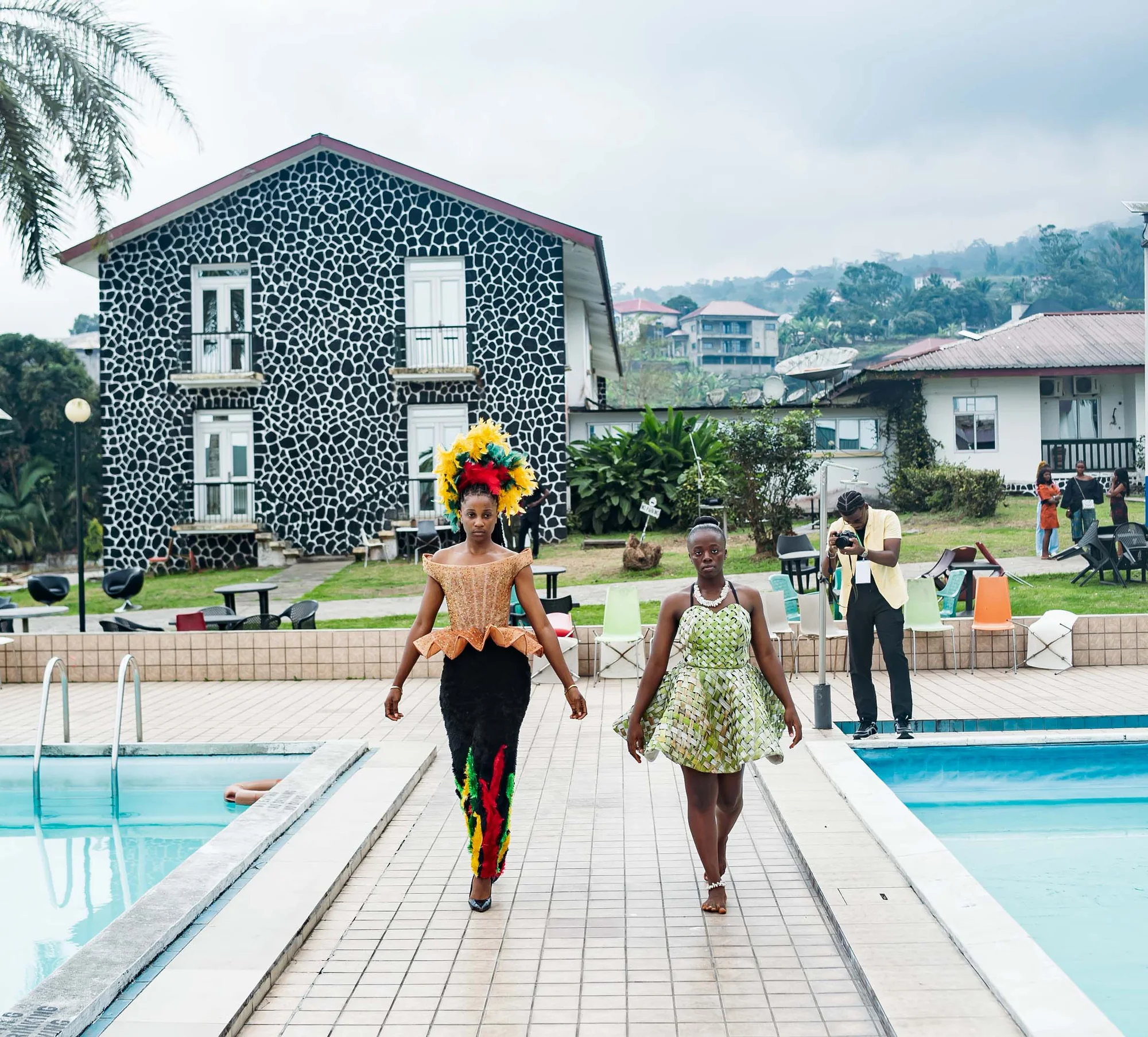 Models walking past the pool at a CAMFFEST 2026 outdoor show