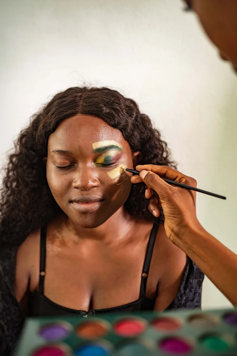 Makeup student having eyeshadow applied