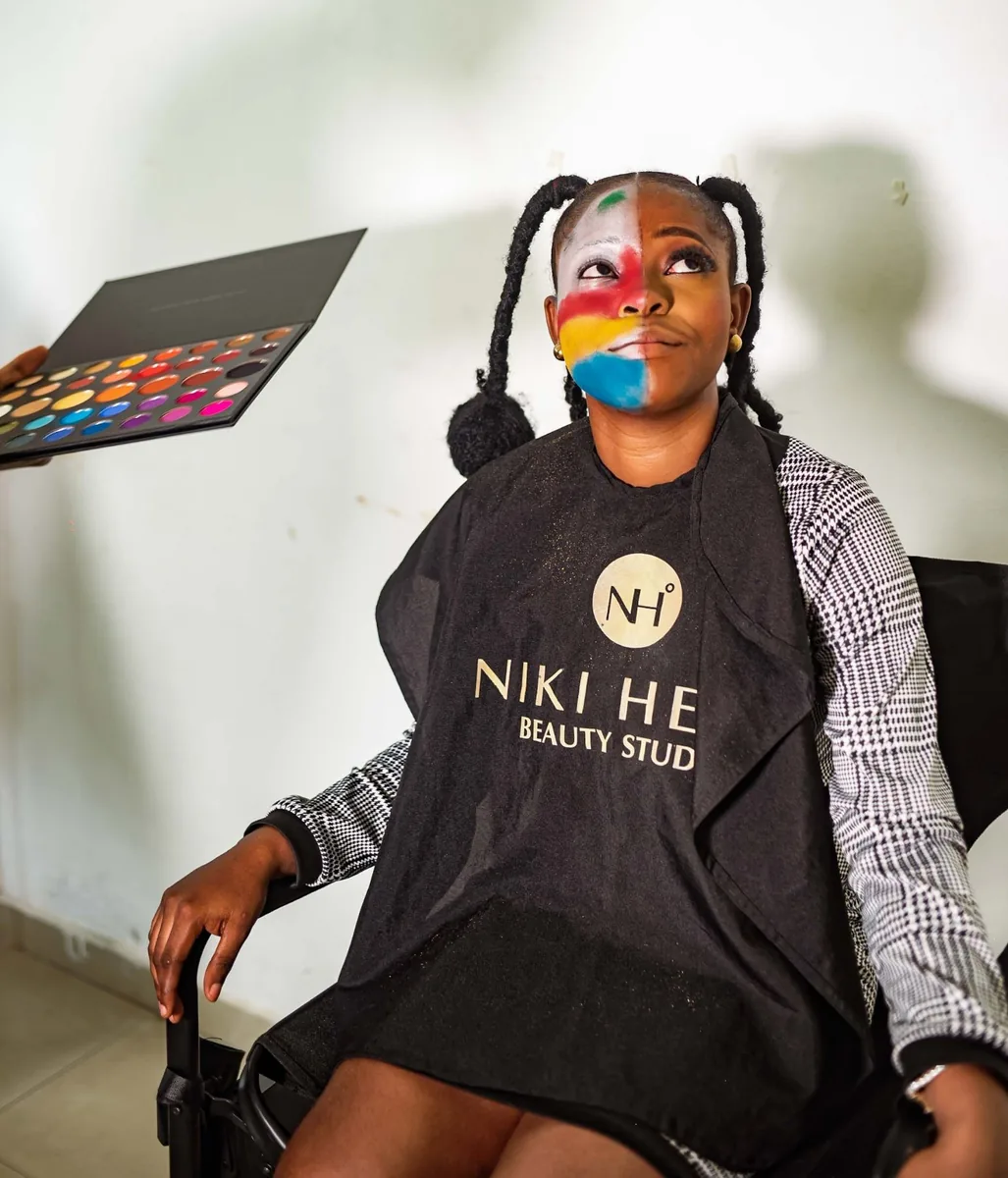 Model with colourful face art from the makeup competition